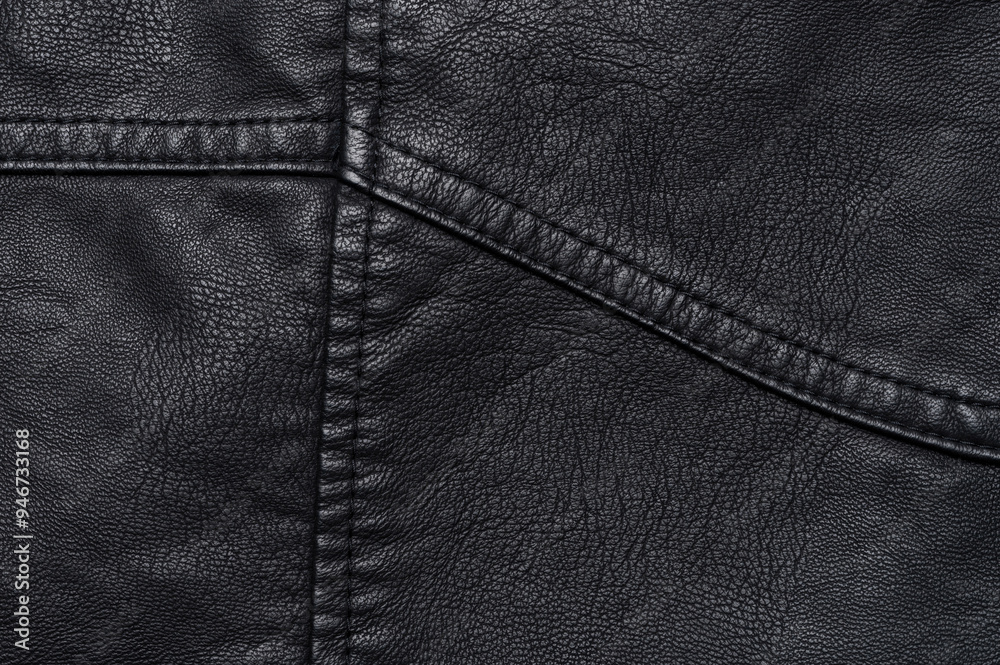 Stitched together black leather pieces Stitched together black leather pieces