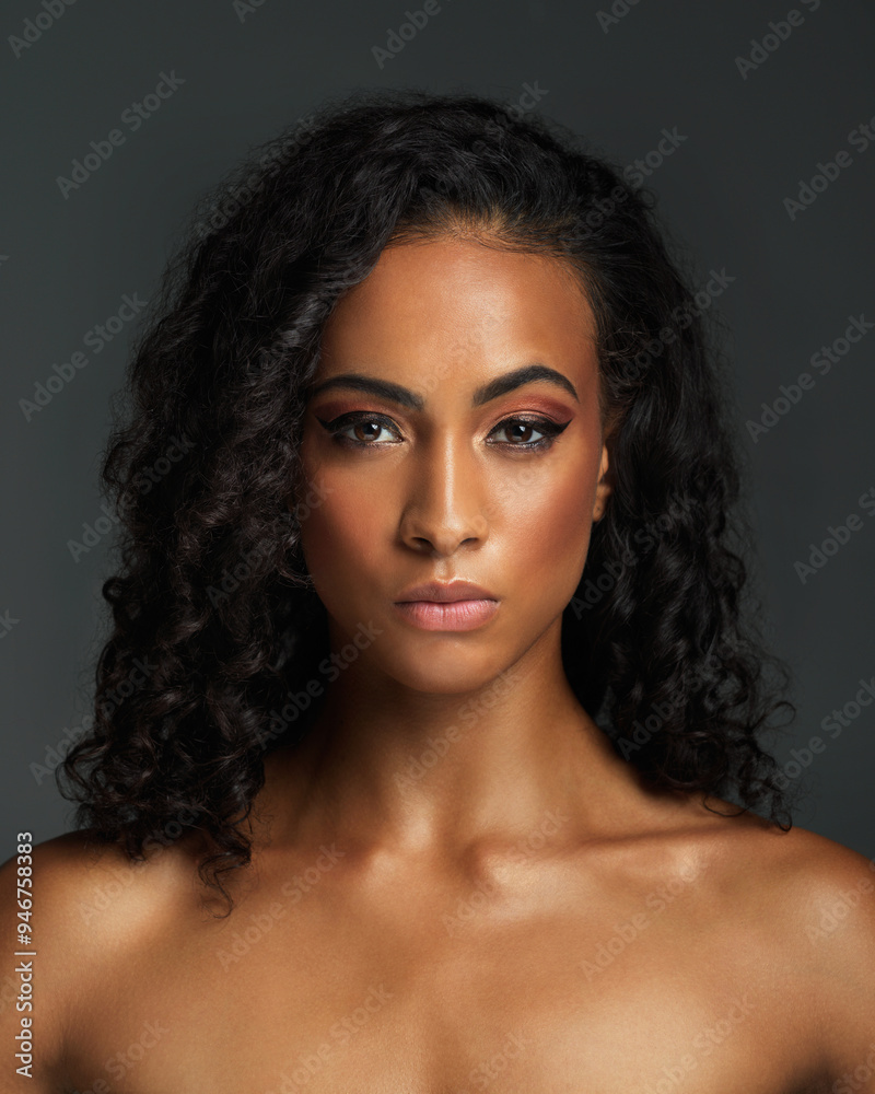 Woman, portrait and glow with beauty in studio with makeup, foundation and eyeshadow for enhance features. Girl, serious and black background with aesthetic cosmetics on face for shine and wellness. Woman, portrait and glow with beauty in studio with makeup, foundation and eyeshadow for enhance features. Girl, serious and black background with aesthetic cosmetics on face for shine and wellness.