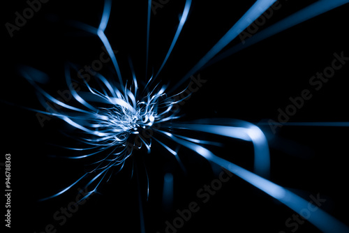 blue sparks from the grinder glowing in the dark
