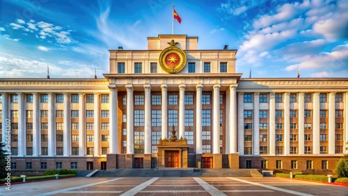 A grandiose, ornate government building with a majestic facade, adorned with hammer and sickle symbols, serves as the seat of political power and ideology. photo