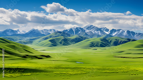 The Splendid Serenity of Nature - Vibrant Grasslands Against Majestic Mountains and Blue Skies