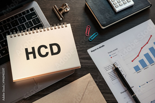 There is notebook with the word HCD. It is an abbreviation for Human Centered Design as eye-catching image. photo