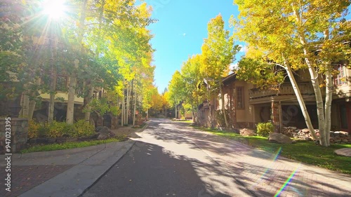 Vail, Colorado city ski resort town in autumn, colorful fall pov point of view walking on road in residential house home area