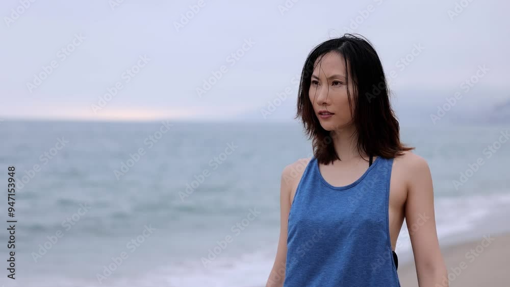 Attractive Asian woman walking on the beach in Santa Monica California. Slow Motion. Attractive Asian woman walking on the beach in Santa Monica California. Slow Motion.