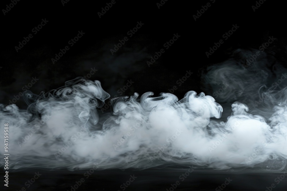 Fototapeta premium Dark smoke billows from the ground on a black background