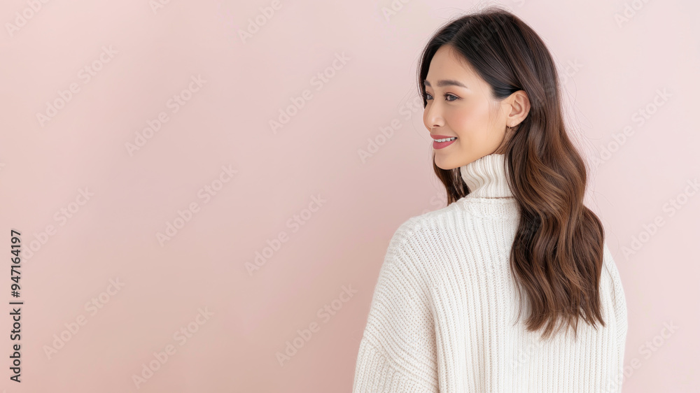 Indonesian woman in white sweater smile to copy space for text advertising Indonesian woman in white sweater smile to copy space for text advertising