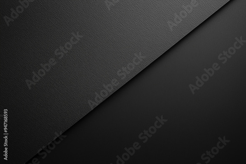 Diagonal split of black textured surfaces. Minimalist dark background design.