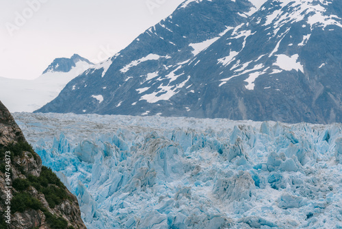 Sawyer glacier at the head of Tracy Arm fjjord in Alaska near Juneau during summer photo