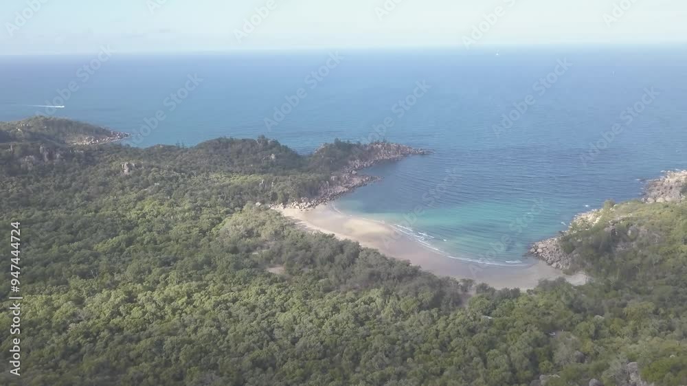 Aerial view of serene Florence Bay with beautiful beach and tranquil coastline, Magnetic Island, Australia. Aerial view of serene Florence Bay with beautiful beach and tranquil coastline, Magnetic Island, Australia.