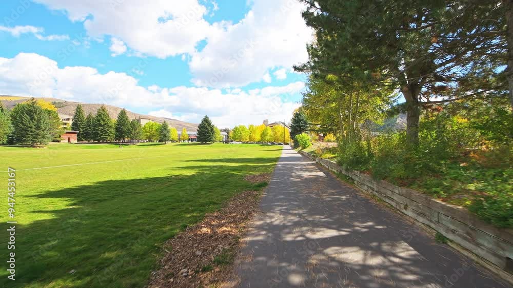 Avon Colorado small town Nottingham park pov point of view walking, people sunbathing on sunny autumn fall day Avon Colorado small town Nottingham park pov point of view walking, people sunbathing on sunny autumn fall day
