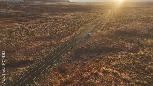 Aerial view of the beautiful sunset over the vast landscape of Vermilion Cliffs National Monument and Marble Canyon with an open road, Page, United States. photo