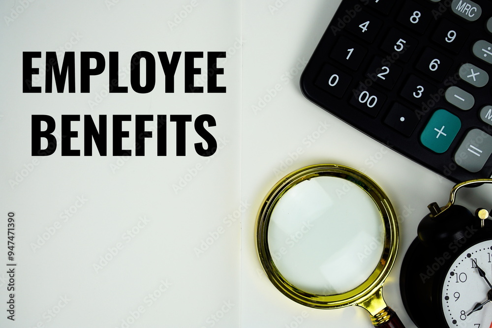 Employee Benefits text message written on note page with calculator, alarm clock and magnifying glass Employee Benefits text message written on note page with calculator, alarm clock and magnifying glass