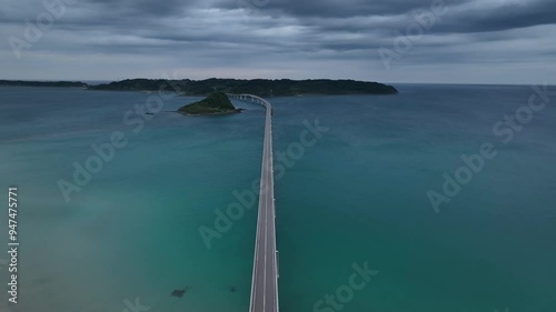 Aerial view of tsunoshima island bridge over the tranquil sea with a beautiful coastline, Nagato, Japan. photo