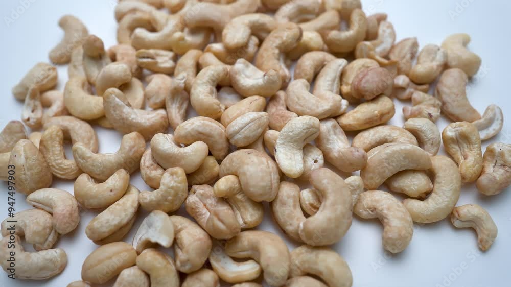 Fresh healthy cashew nuts rotated view white background Fresh healthy cashew nuts rotated view white background