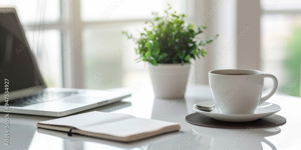 laptop on the table with a cup of coffee beside laptop on the table with a cup of coffee beside
