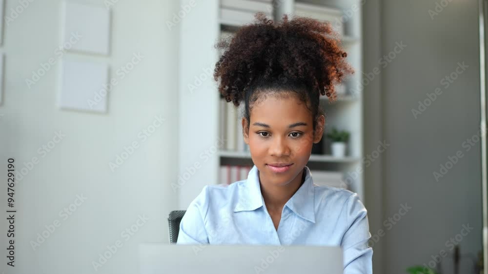 African american businesswoman sitting and recording data details in financial business Online marketing plan to process and send emails for meeting preparation sitting at laptop desk in office. African american businesswoman sitting and recording data details in financial business Online marketing plan to process and send emails for meeting preparation sitting at laptop desk in office.