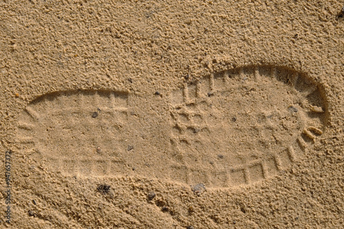 Footprint in the sand forensics, three-dimensional visible trace left at the scene of the crime, forensic examination of traces photo