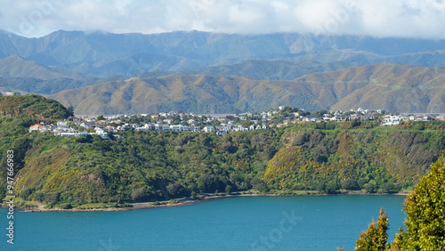 Scenic panoramic view of houses nestled on hills of Miramar Peninsula overlooking ocean in capital city of Wellington, New Zealand Aotearoa