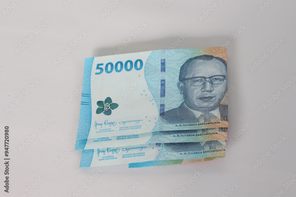 Indonesian Rupiah. Fifty thousand rupiah in cash. Indonesian Rupiah. Fifty thousand rupiah in cash.