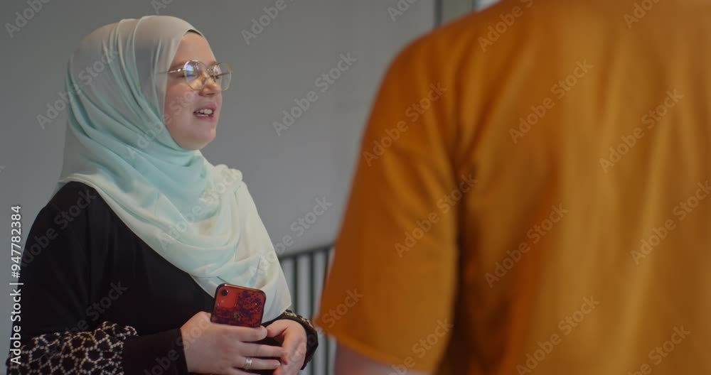 A diverse group of business colleagues engage in discussions about various business challenges, surrounded by their coworkers in a modern startup office, showcasing teamwork, innovation, and problem