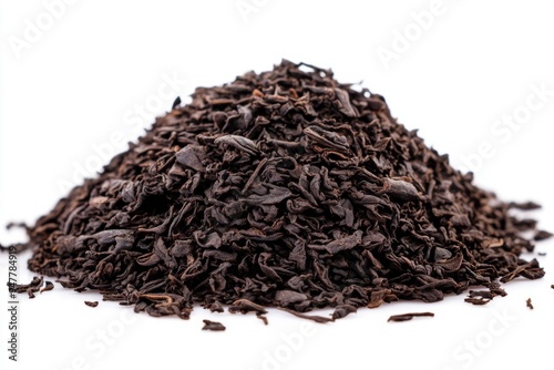 A Heap of High Quality Loose Black Tea Leaves isolated on a Pure White Background. Tea Brewing