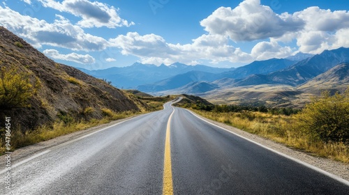 A long road with a mountain in the background