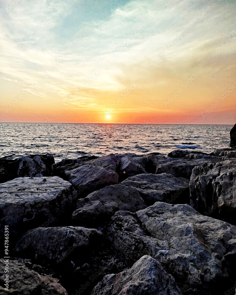 Sunset over the sea and the rocks Sunset over the sea and the rocks