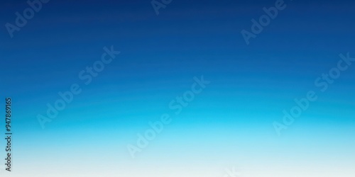 Fototapeta Naklejka Na Ścianę i Meble -  A bright, clear blue sky with no clouds, creating a smooth, open atmosphere.