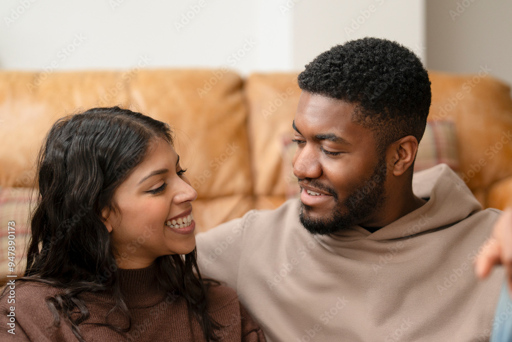 Joyful Couple Enjoying a Warm Moment on a Cozy Couch During a Relaxing Afternoon at Home Joyful Couple Enjoying a Warm Moment on a Cozy Couch During a Relaxing Afternoon at Home