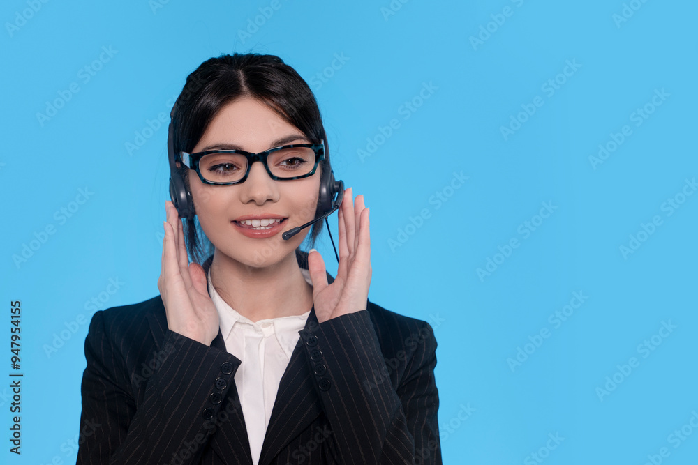 Engaging Call Center Employee Smiling While Providing Customer Support in a Vibrant Blue Setting Engaging Call Center Employee Smiling While Providing Customer Support in a Vibrant Blue Setting