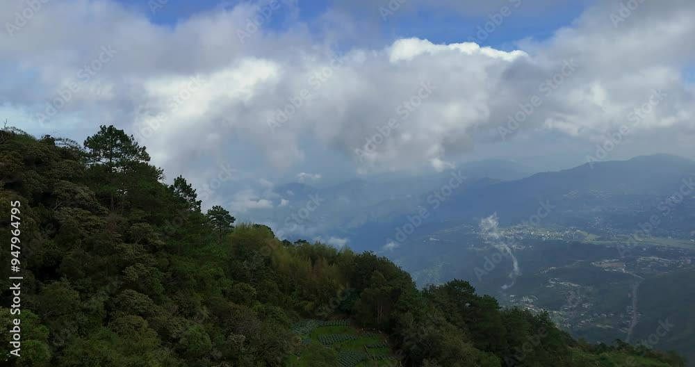 An aerial photograph capturing smoky clouds, abundant greenery, and a breathtaking panoramic vista of the town below. An aerial photograph capturing smoky clouds, abundant greenery, and a breathtaking panoramic vista of the town below.