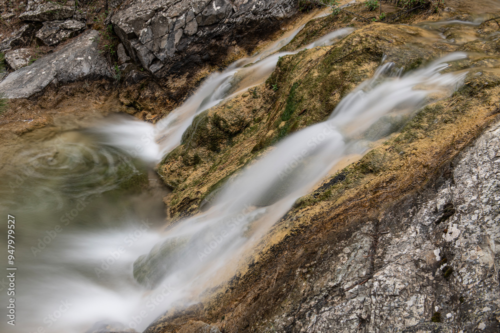 Small waterfall captured with long exposure. View of the waterfall taken from the top. Waterfall photo taken with long exposure technique. Nallıhan Ankara, Türkiye. Small waterfall captured with long exposure. View of the waterfall taken from the top. Waterfall photo taken with long exposure technique. Nallıhan Ankara, Türkiye.