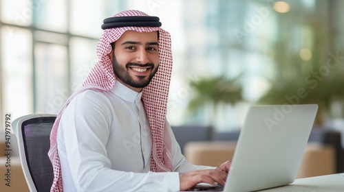 Arab businessman using a laptop photo