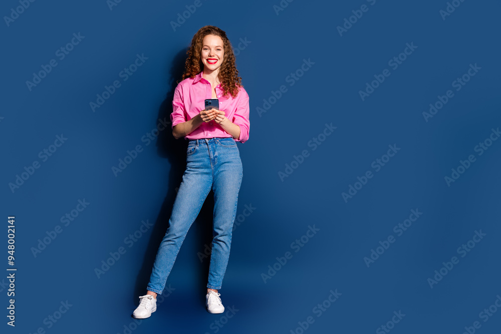 Full body portrait of pretty young lady smart phone empty space wear shirt isolated on dark blue color background