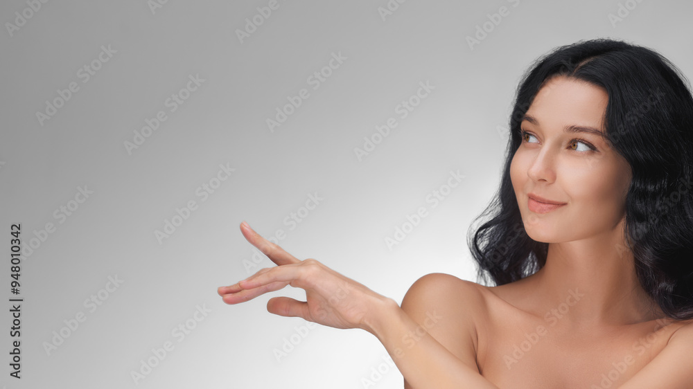 Beautiful Asian Woman Pointing Up with Copy Space for Skincare Concept Beautiful Asian Woman Pointing Up with Copy Space for Skincare Concept