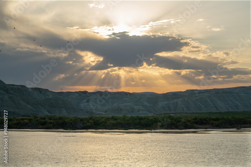 Sunset view by the lake in the evening. Sunset over the lake in the evening. Sunset from the campsite in the evening.