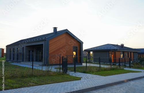 Modern Scandinavian Barnhouse Project. Contemporary barn design as suburb house. Barn House Design. Barn House in village. Ultra modern Architect-designed luxury house. Wooden Scandi home in rural. photo