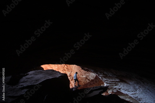 homem na gruta do zé sem chapéu, na região de pinga fogo, interior de mineiros, goiás photo