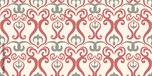 ikat seamless vintage pattern with delicate floral motifs in pink, gray, and cream. The repeating design adds a soft, elegant touch to any space.