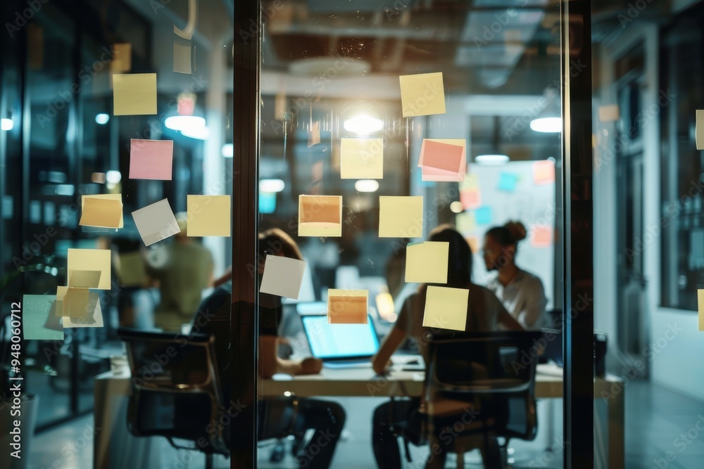 The building blocks for a brand new marketing campaign Shot of sticky notes on a glass window with businesspeople having a late night brainstorming session in a modern office The building blocks for a brand new marketing campaign Shot of sticky notes on a glass window with businesspeople having a late night brainstorming session in a modern office