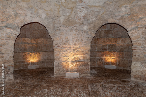 interior of a stone cave or crypt with lighting in a church or castle