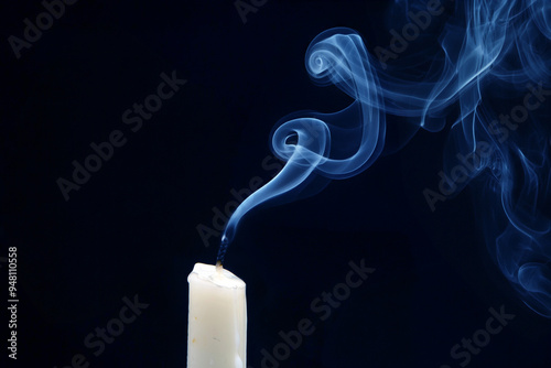 Tableau sur toile Smoke from an extinguished candle on a dark background