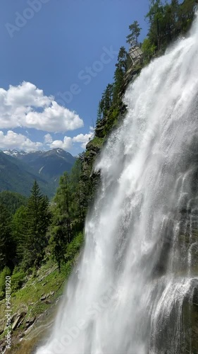 Stuibenfall waterfall bigest waterfall in Tirol in the Otztal valley in Tyrol Austria during a beautiful springtime day in the Alps. Vertical video. photo