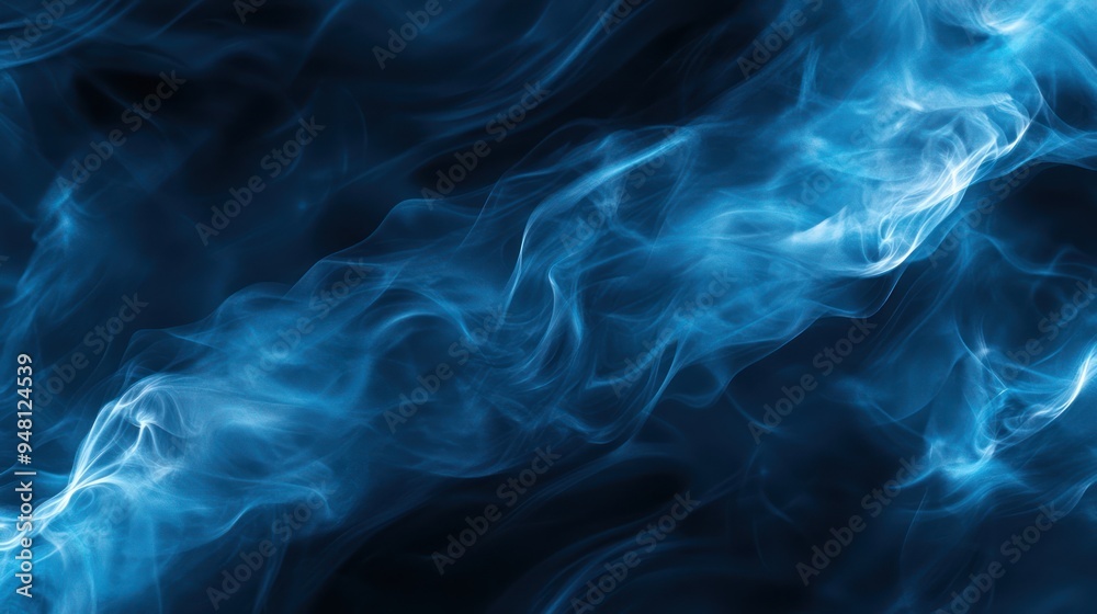 Fototapeta premium Abstract blue smoke swirling elegantly against a dark background.