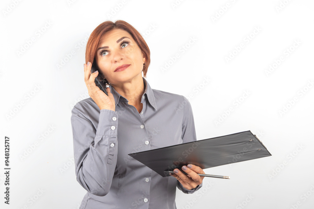 Business lady with phone and documents in hands on white background. Business lady with phone and documents in hands on white background.