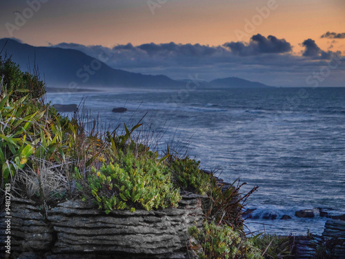 Pancahe rocks at Punakaiki Paparoa South island New Zealand at sunset. Coastline. Westcoast. photo