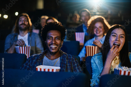 Diverse group of friends enjoying a movie together in a cinema
