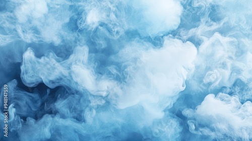 Abstract blue smoke swirls creating a serene and ethereal atmosphere.