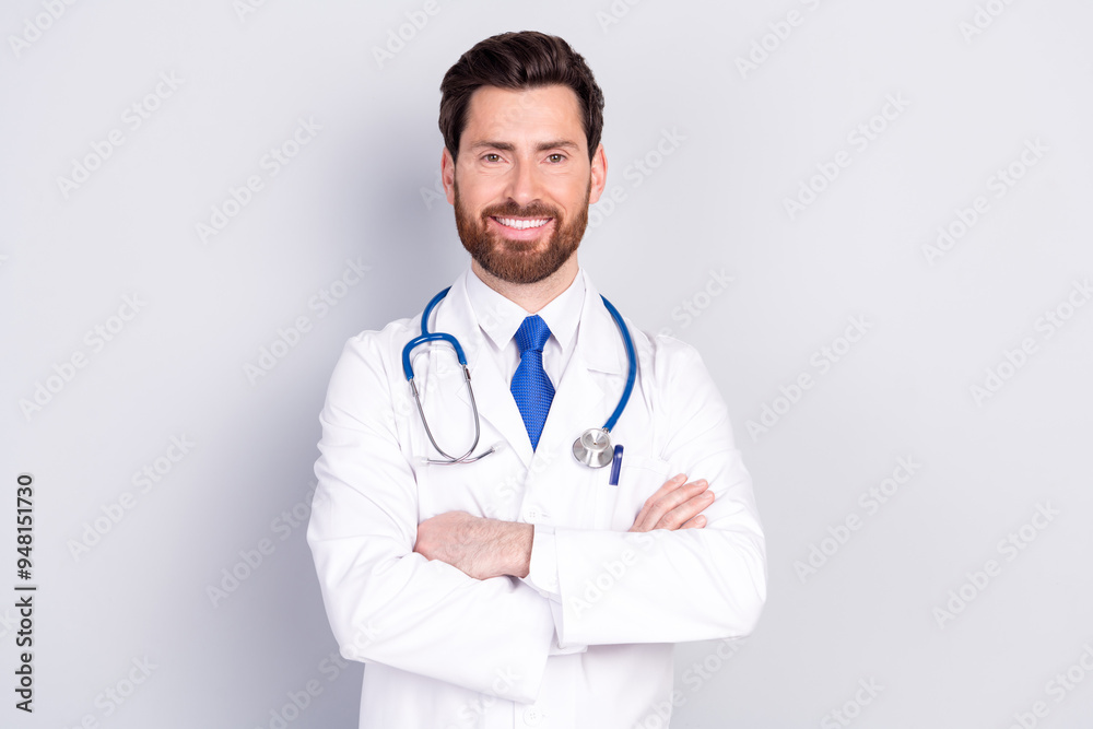 Portrait of experienced doctor man folded arms wear white coat isolated on grey color background
