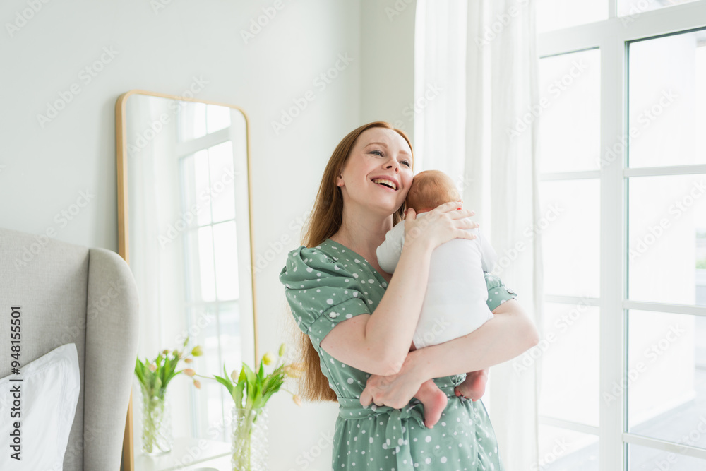 Happy family at home. Mother holding little toddler child daughter. Mom and baby girl relax playing having fun together at home. Mother hugs baby with love care. Mom of breast feeding baby Happy family at home. Mother holding little toddler child daughter. Mom and baby girl relax playing having fun together at home. Mother hugs baby with love care. Mom of breast feeding baby
